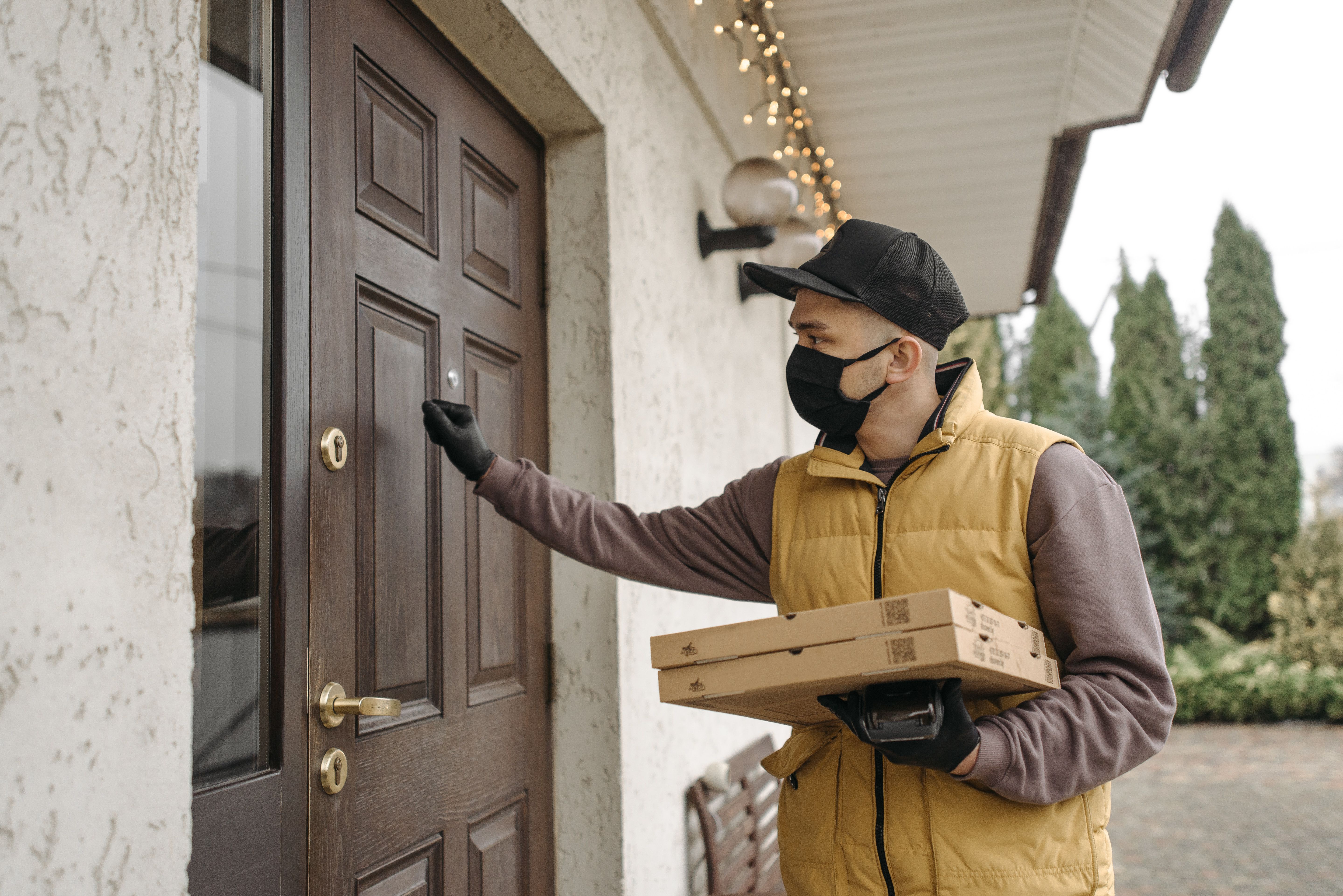 Photo: a delivery arriving at the door (colour)